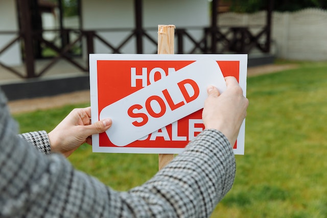 A 'For Sale' sign in front of a Cedar City home